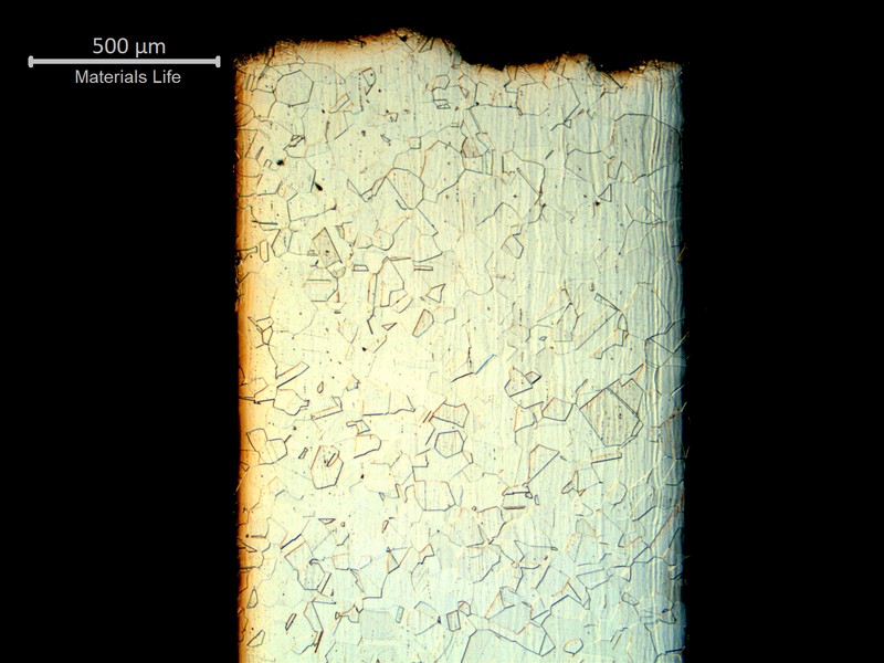 Micrography of a longitudinal section of the tubing where the fracture occurred. the left side is the outer diameter and the right side is the inner diameter.