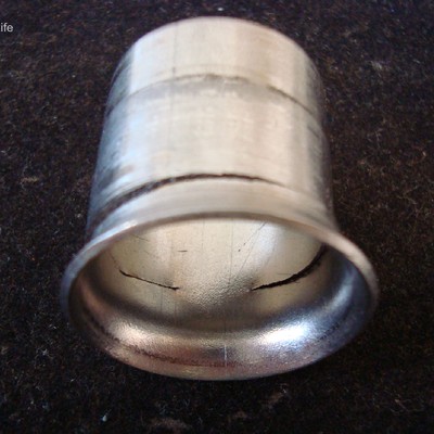Same flared tubing, with a circumferential crack, with the focus at the internal side.