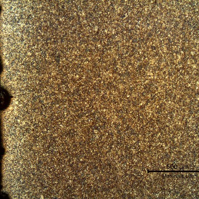 Micrography of a longitudinal section of the pipe, at the external pipe surface, where there is a corroded spot.  The microstructure is tempered martensite and at the surface the pipe is slightly decarburized.
