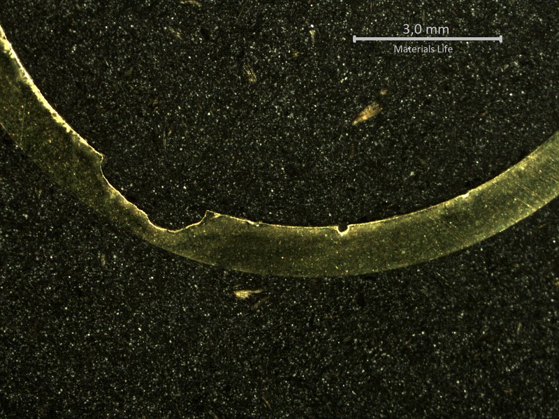 Macrography of a transverse section of the tube close to the leakage point, evidencing a localized thinning from the internal side of the tube.