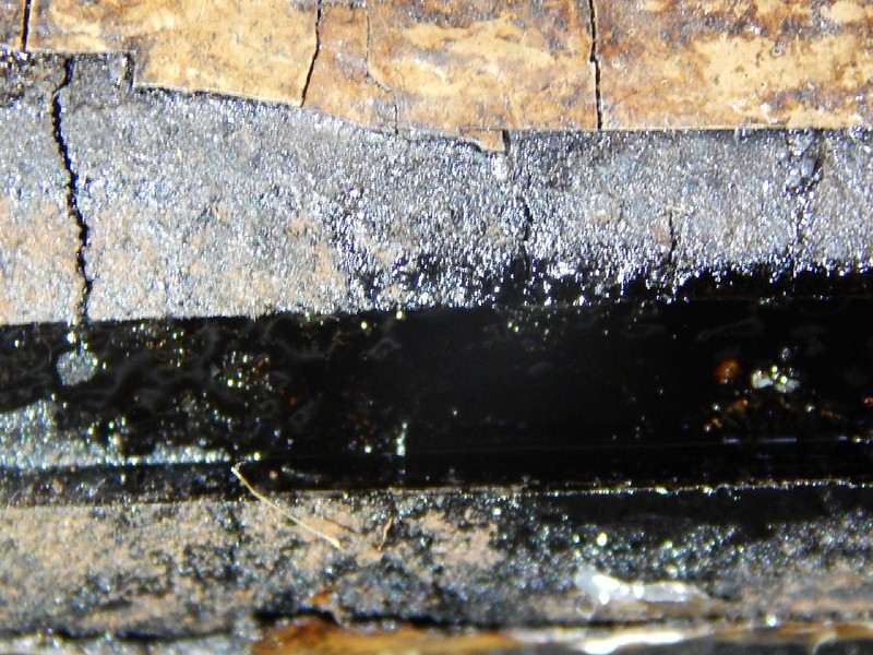 Detailed aspect of the cracks at the clamp substrate and at the coating.