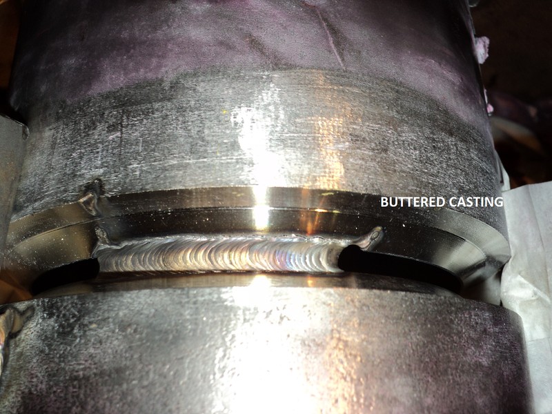 Condition of the joint between the centrifugally cast tube (bottom) and the buttered fitting (top).  During this welding the cast fitting (buttered) showed several cracks but after removal of the fitting it was clear that the cracks were formed during the buttering and not during the joining.