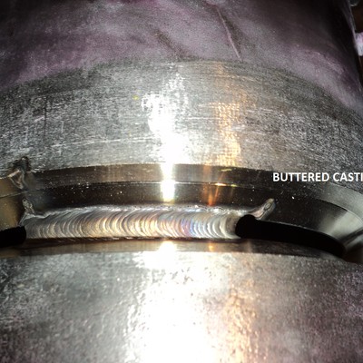 Condition of the joint between the centrifugally cast tube (bottom) and the buttered fitting (top).  During this welding the cast fitting (buttered) showed several cracks but after removal of the fitting it was clear that the cracks were formed during the buttering and not during the joining.