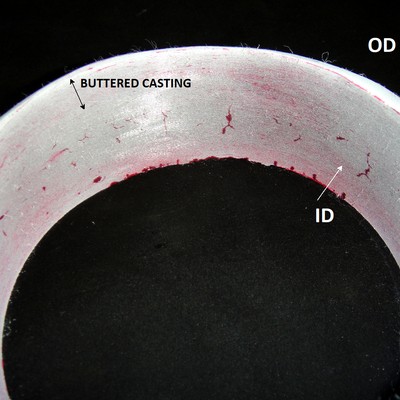 After removal of the cracked part of the fitting, the dye check test indicated the presence of several cracks in the internal diameter (ID), out of the buttered layer, that means, in the fitting base metal.