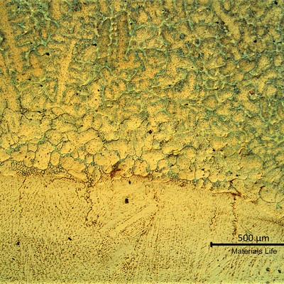 Fusion line between the aged base metal (in the top) and the weld metal (in the bottom).  The adopted filler metal is similar to the base metal.