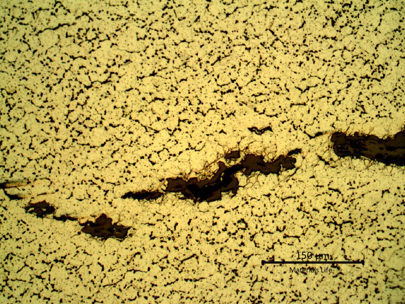 Detailed microstructure of the plate base metal, exposed to high temperature exhausting gases.  Refined austenite, precipitation of carbides in the grain boumdaries and some cracks.