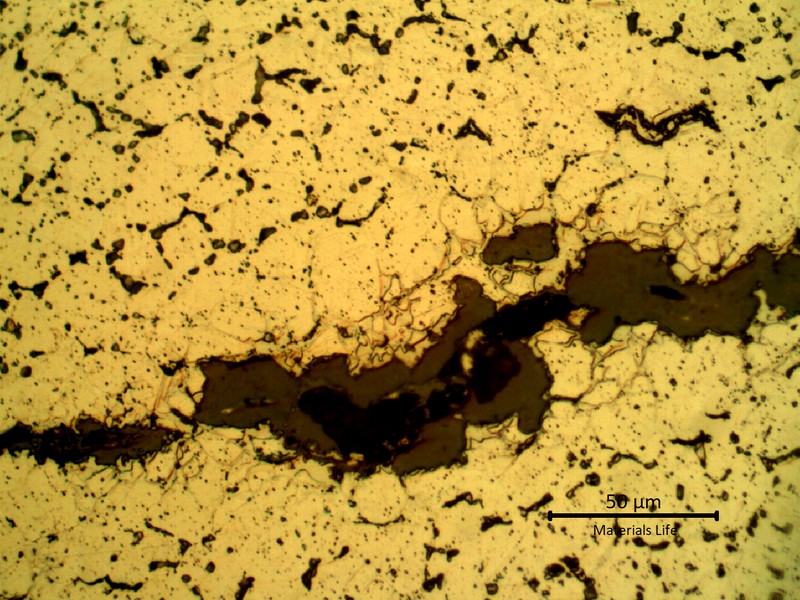 Detailed microstructure of the plate base metal, exposed to high temperature exhausting gases.  Refined austenite, precipitation of carbides in the grain boumdaries and some cracks.