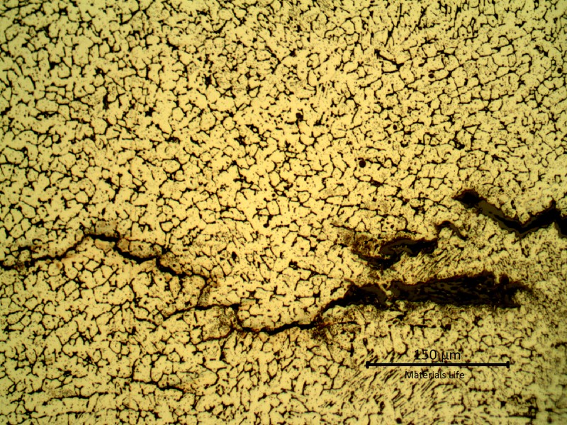Detailed microstructure of the weld metal, exposed to high temperature exhausting gases.  Austeno-ferritic structure and some cracks.
