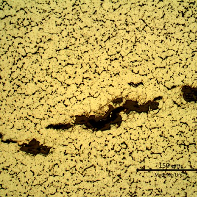 Detailed microstructure of the plate base metal, exposed to high temperature exhausting gases.  Refined austenite, precipitation of carbides in the grain boumdaries and some cracks.