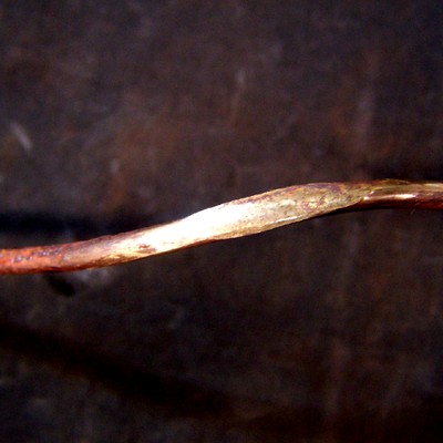 One disassembled wire, 3.2mm diameter, from a strand. The wire presents strong plastic deformation. In a very localized area.