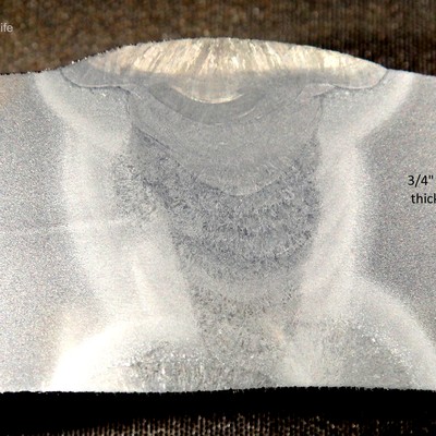 Macrography of the longitudinally seam weld of the 24" diameter tube, showing that it was welded from both sides and there is a segregation line in the center of the tube thickness.