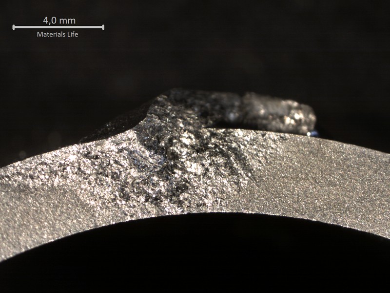 Aspect of the opened crack, showing the flat fracture. The through wall cracking started at the welded region at the end of the rib.