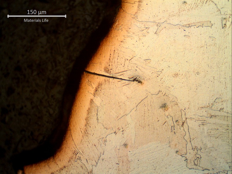 Brittle crack in the surface of the welded joint, at the heat affected zone close to the fusion line.