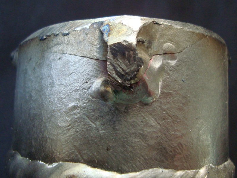 Detail of the through wall cracking that caused the leakage  in the 2" pipe. The crack was originated in the fillet weld,  from the end of the reinforced rib.