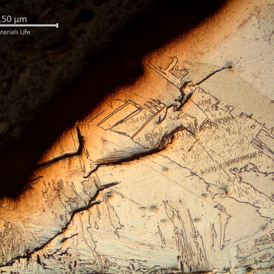 Micrography of the weld metal at the fillet weld where the cracking started, showing several brittle microcracks that corresponds to the regions where the fractography showed secondary crackis.