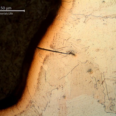 Brittle crack in the surface of the welded joint, at the heat affected zone close to the fusion line.