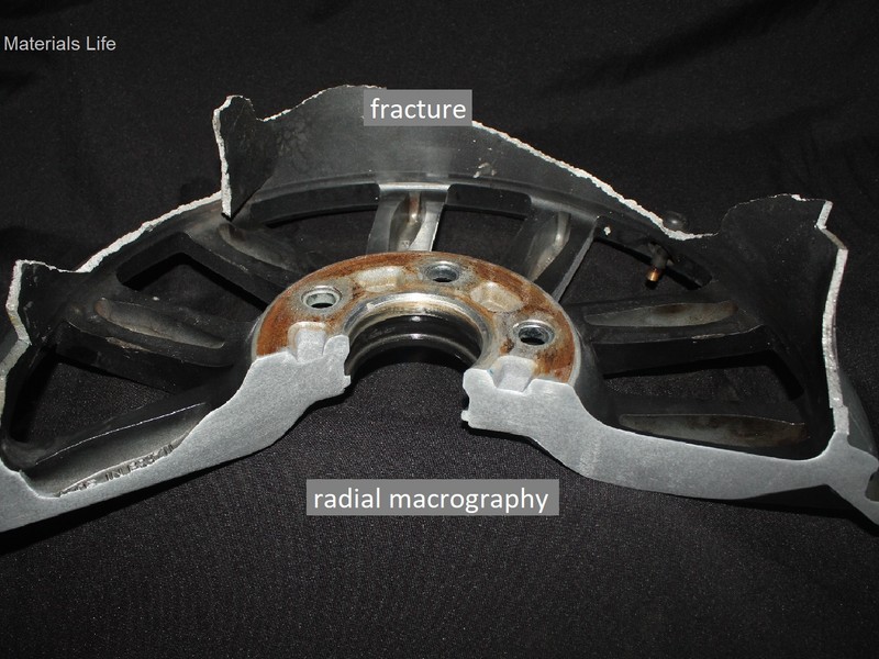 Macrography of a radial section of the WHEEL 1. The fracture occurred in the cylindrical wheel outer edge, the rim, and the thickness of the part in the fracture location varied from 2.5 mm to 4 mm.
