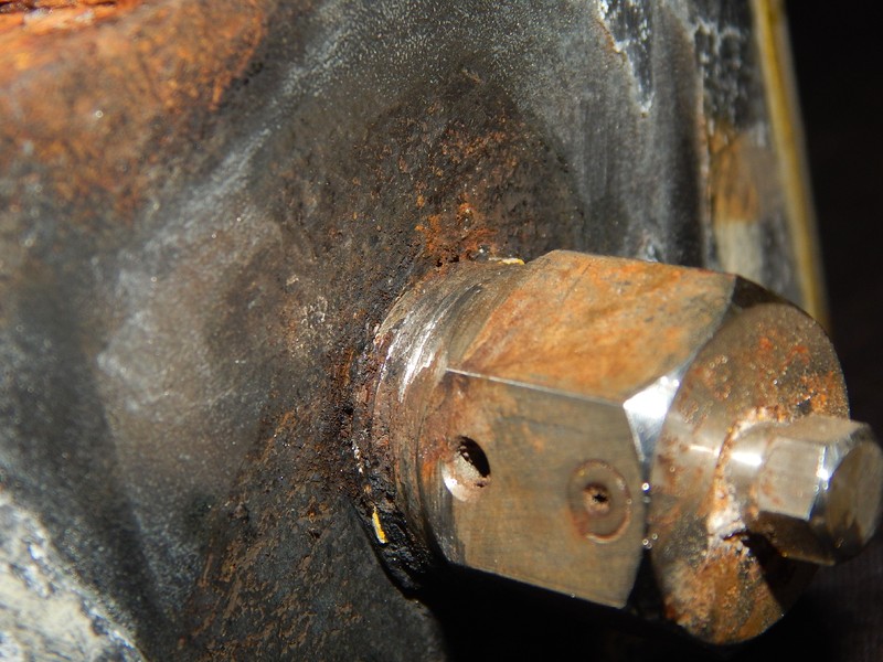 The painting of the valve body was detaching at the vent location where the fitting was installed, not fully tighted. Three threaded fillets were outside of the body.