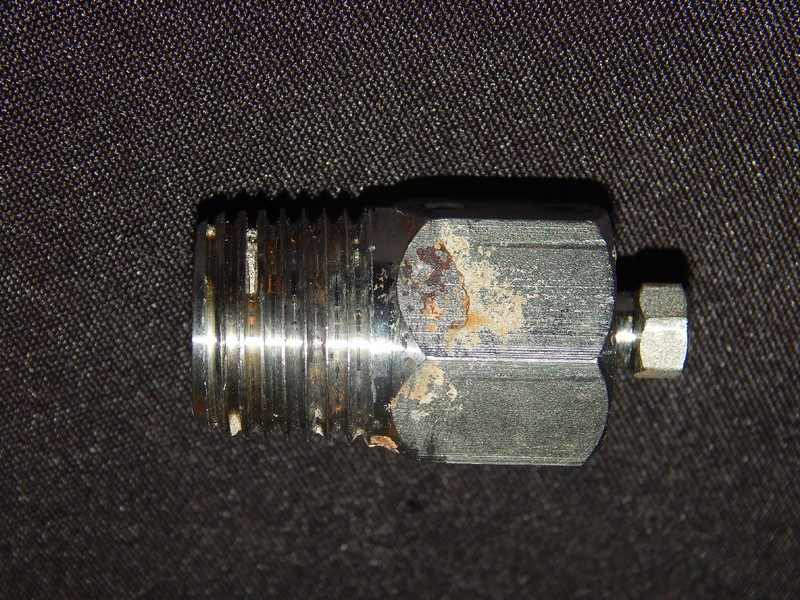The cleaned fitting is sound. No corrosion, only surface stains.