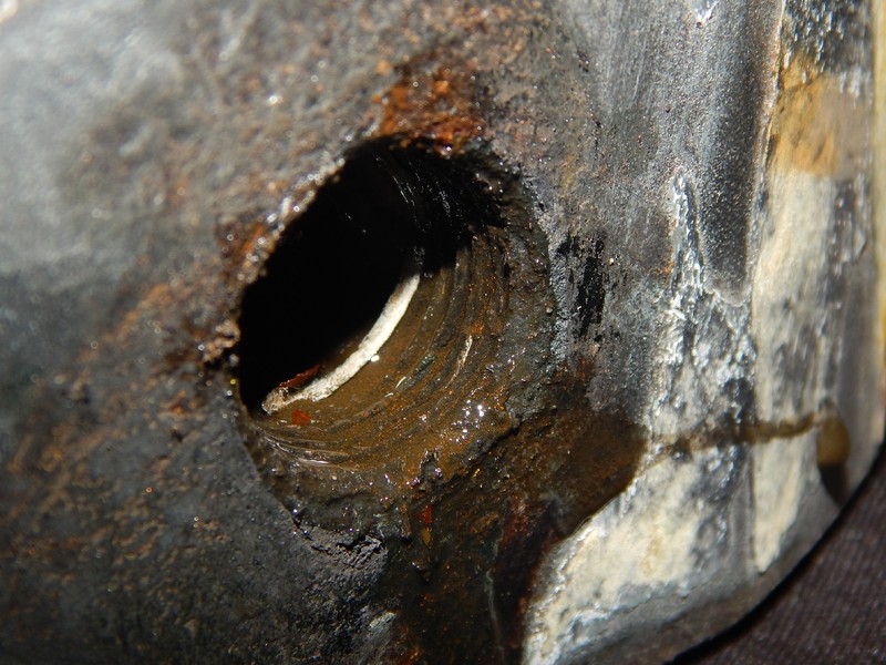 The threads of the carbon steel valve body is corroded. The offshore ambient is wet and chloride rich, creating an aggressive environment for the carbon steel threads.