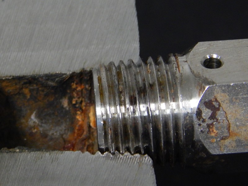 Macrosection of the valve body at the thread, showing the position where the fitting was installed.