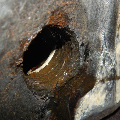 The threads of the carbon steel valve body is corroded. The offshore ambient is wet and chloride rich, creating an aggressive environment for the carbon steel threads.